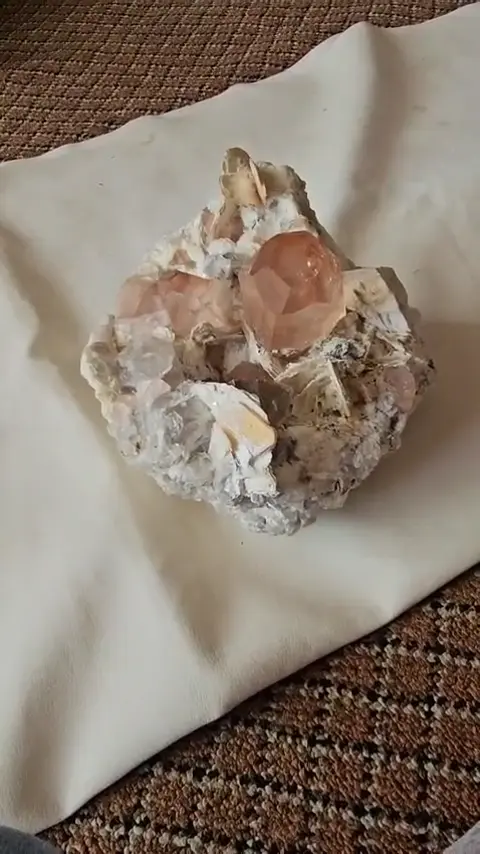Peach crystal on matrix