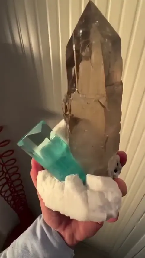 Blue crystal with a smoky point