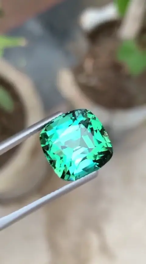 Faceted blue-green gemstone