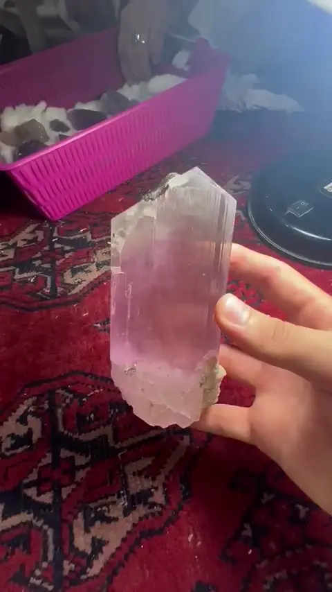 Pink crystal in hand